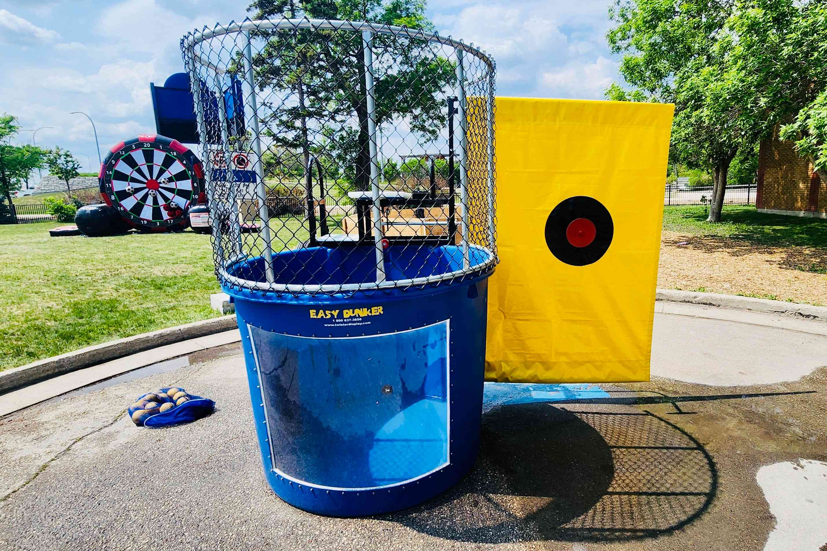 Dunk tank rental for summer parties and school events in Winnipeg Manitoba by Jump Up Bouncers