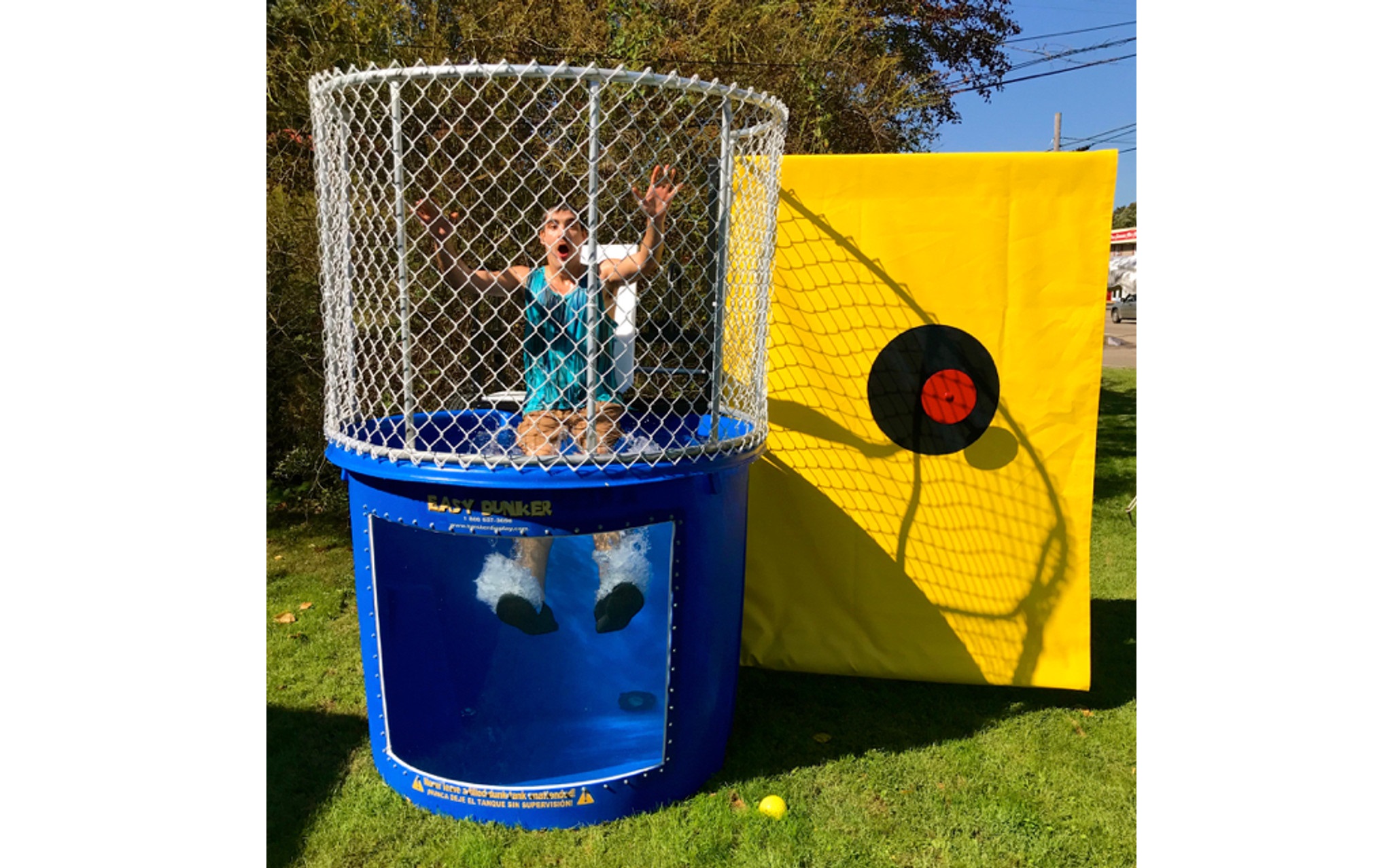 Dunk tank inflatable game rental for corporate team-building events in Winnipeg Manitoba