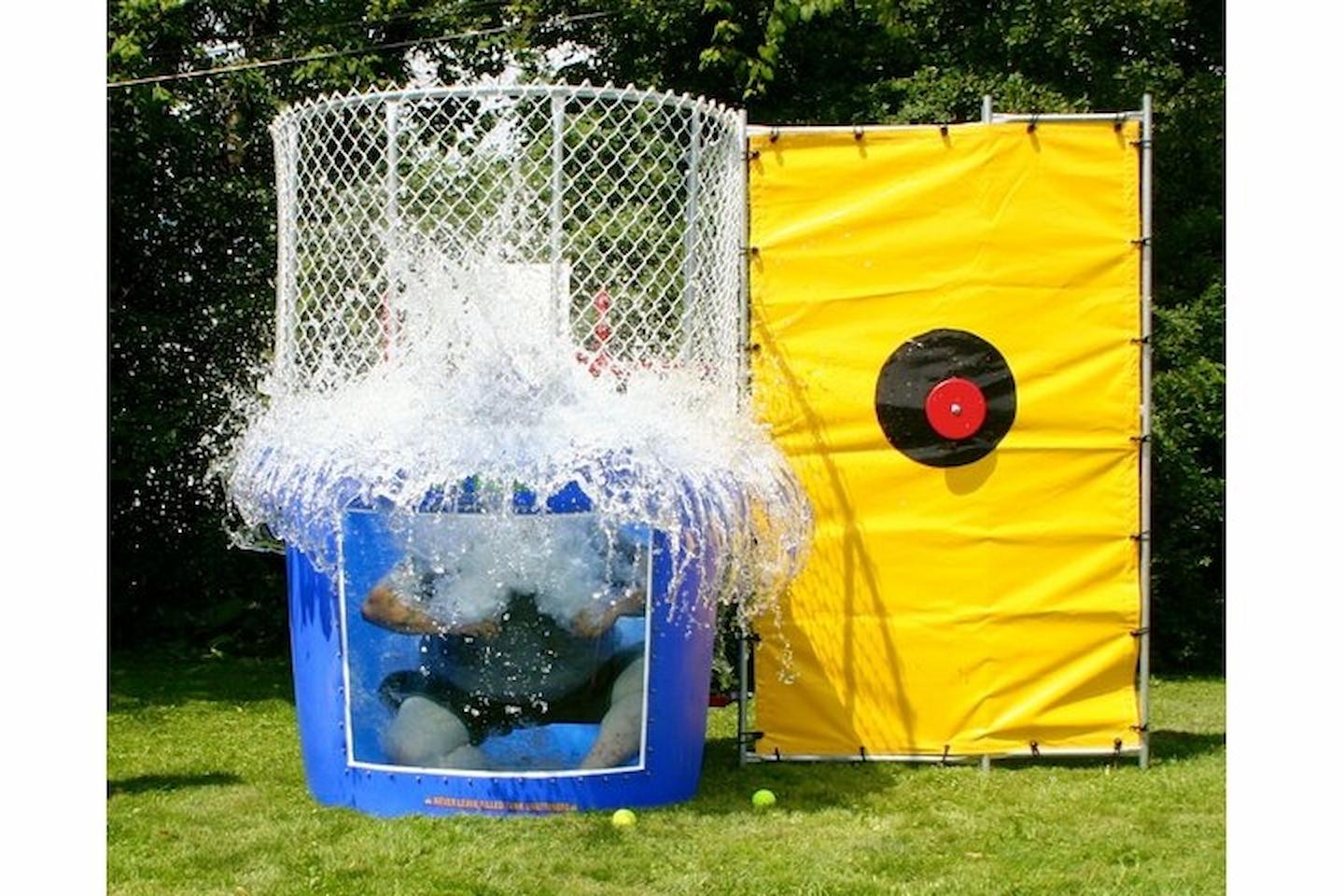Jump Up Bouncers dunk tank setup at Winnipeg outdoor party rental event